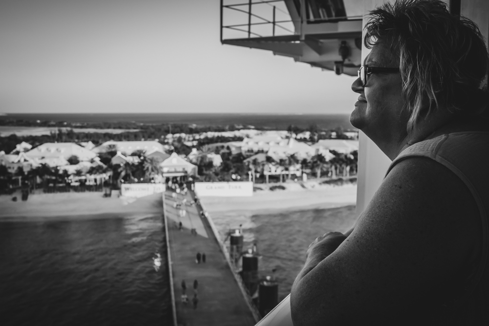 AnnMarie looking out over Grand Turk from a ship's balcony